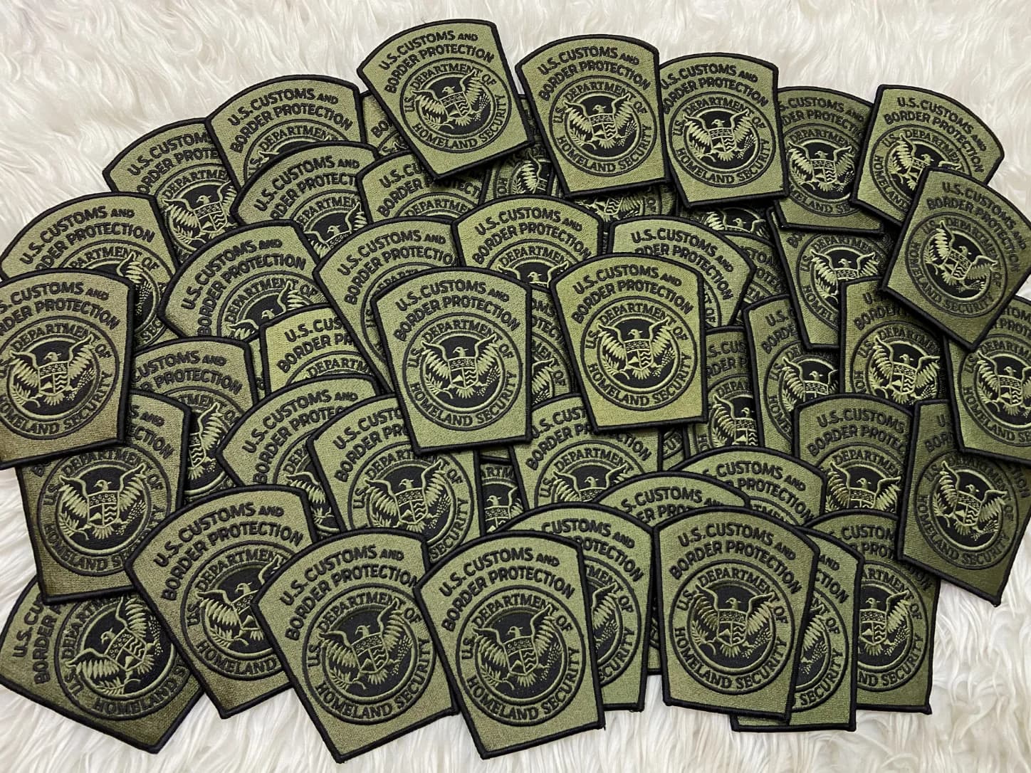 Olive and black U.S. Customs and Border Protection patches